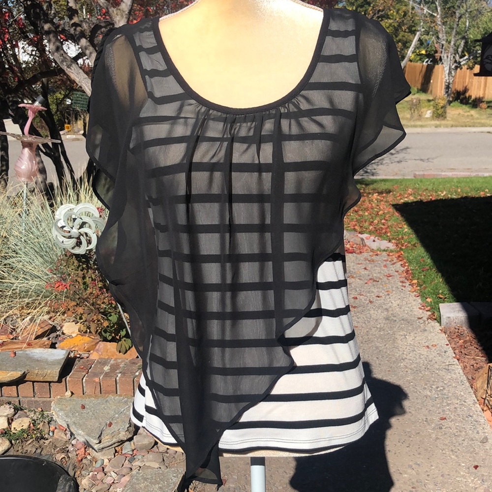 Women’s knit top with chiffon overlay.